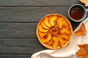 Homemade traditional sweet autumn tart pie on wooden table