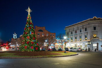 Historic town square with holiday tree lit up at night at Christmas, Gettysburg, Pennsylvania. Winter travel and tourism.