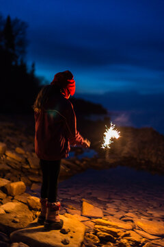Little Girl with Sparkler at Beach