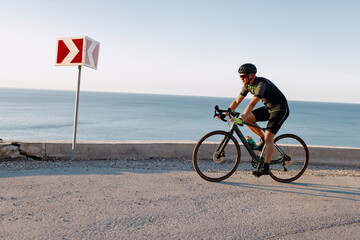 Professional road bicycle racer in action on mountain road