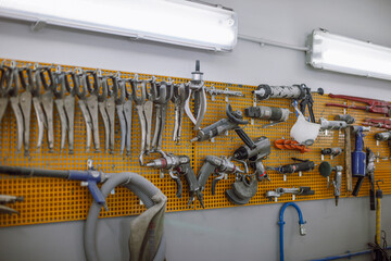 Tools of a vehicles mechanic in a cars workshop.