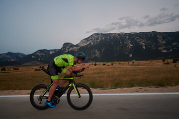 Fototapeta premium triathlon athlete riding bike