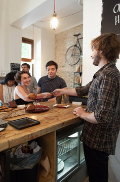 Customer Paying Cashier in Coffee Shop