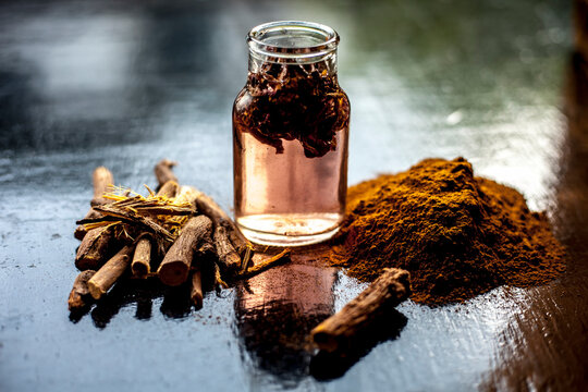 Ayurvedic DIY piles cream consisting of Revand chini root powder well mixed with rose water. Shot of revand chini powder along with some fresh organic rose water in a glass bottle.
