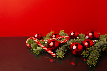 Christmas festive background with coniferous branches and Christmas balls