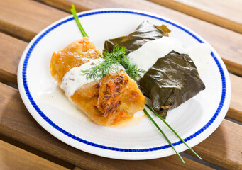 Authentic Bulgarian dish Sarma and Dolma. Rice and minced meat wrapped in cabbage and grape leaves