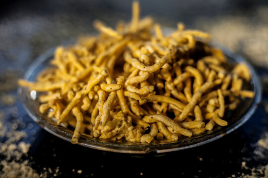 Close up shot of Gujarati famous tea-time snack dish Bhavnagiri gathiya in a serving plate. Shot of freshly prepared thikkha bhavnagari gathiya in a serving plate.