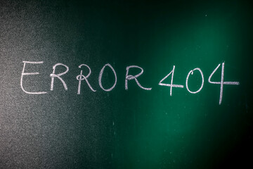 Error 404 written on green board with chalk, Page Not Found Error 404 written on a blackboard with chalk.