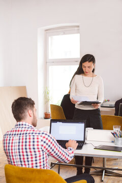 Man Working On Laptop At His Desk