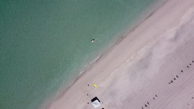 Man sells ice cream into the sea, 360 view. Tecolote beach, La Paz, Baja California Sur, Mexico