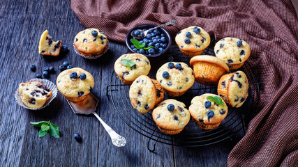 Blueberry muffins on a rustic wooden background