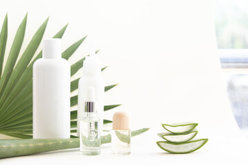 Aloe Vera leaf slice with essential oil. Natural lotion for skin care.