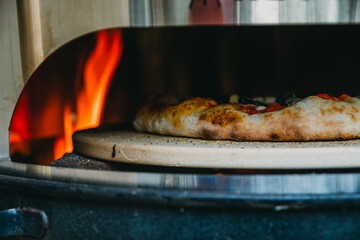 Home Made Pizza Baking in a Grill Barbecue Oven