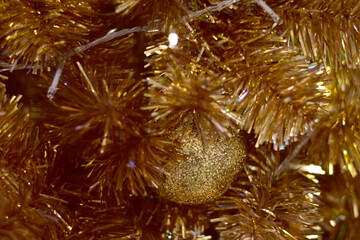 Obraz na płótnie Canvas Closeup of Christmas Ball on Christmas Tree with bokeh beautiful background for design and decoration, new year concept, selective focus.