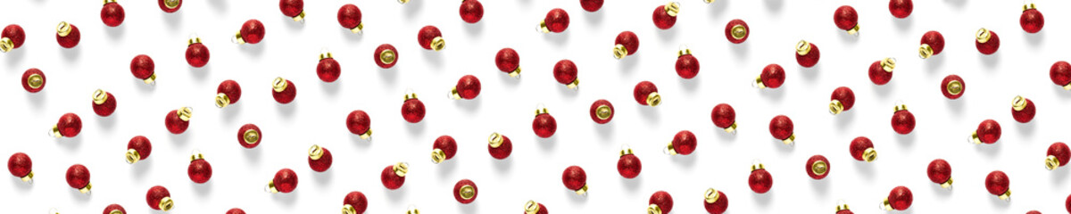 Christmas red decorations on white background. Christmas ornaments composition for background. Flat lay of red ornaments