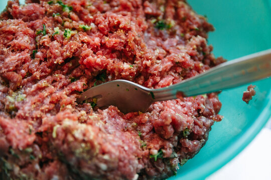 Spiced raw meat ready for making hamburgers for a bbq