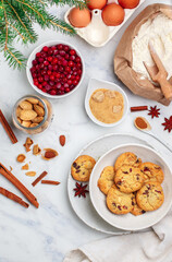 Freshly baked homemade Christmas cookies with cranberries, almonds, white chocolate, cinnamon and star anise. Delicious festive biscuit. Gingerbreads. Selective focus