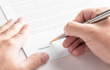 Businessman is signing a contract, business contract details