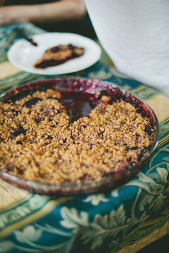 High angle view of cherry crumble on furnished table