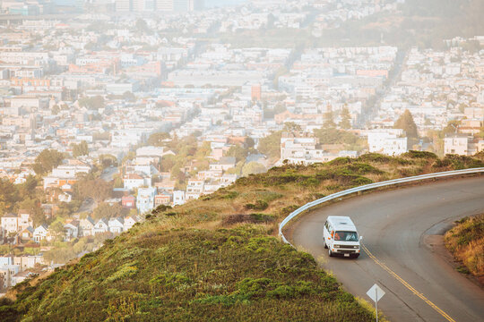 young travelers drive down a windy road in California.