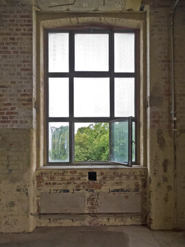 open window in an old decaying hall