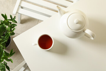 Concept of breakfast with tea on white table