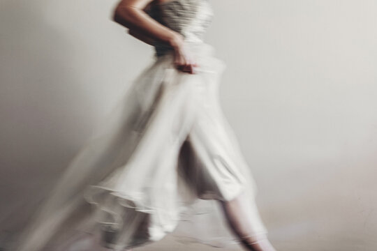 Woman running in a long evening gown