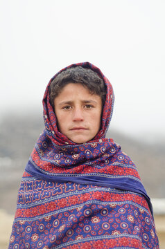 A Boy standing in chilly weather of Quetta Valley.