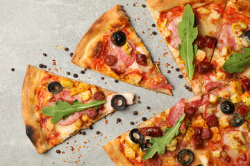 Tasty meat pizza on gray background, top view
