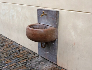 Metal water tap and stone sink