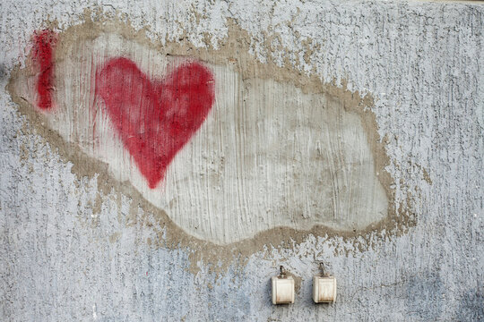 Love graffiti on damaged wall