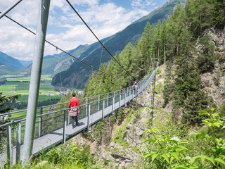 Fototapeta na wymiar Hiking suspension bridge between the hamlets of Brand and Burgstein. Längenfeld, Tyrol, Austria