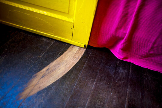 Hardwood floor with Groove in it from Door