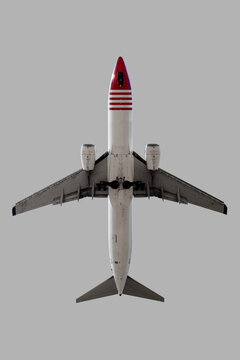 Airplane over grey background.