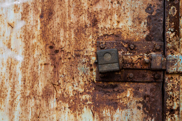 Old door with an old lock. Old padlock.