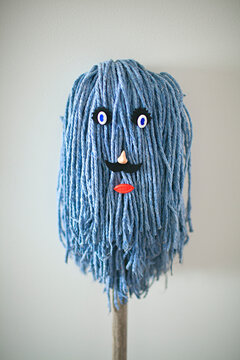 character / faces created using cleaning items mop and broom