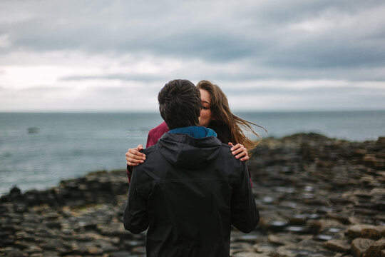 Young Guys Kissing Passionate At the Giant Causeway