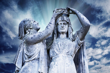 Obraz premium Virgin Mary Queen of Heaven blessed among women. Very ancient stone statue. Selective focus on face and eyes.