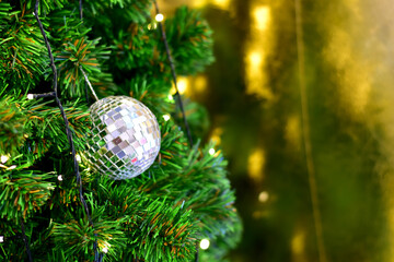 Closeup of Christmas Ball on Christmas Tree with bokeh beautiful background for design and decoration, new year concept, selective focus.