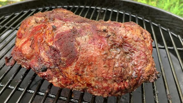 Liestal, Switzerland - September 22, 2020: A large piece of roast pork on the grill