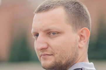 Obraz premium A male student looks over his shoulder. He n excursions