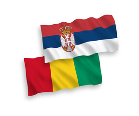 Flags of Guinea and Serbia on a white background