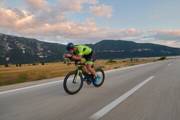 Fototapeta premium triathlon athlete riding bike