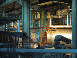 Pipes, steel tubes, steam turbine and equipment at power plant, night scene