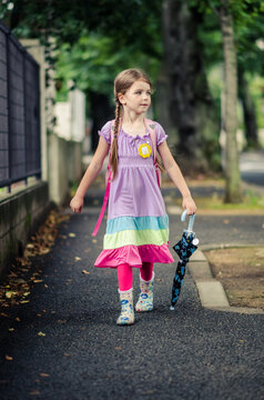 Young Girl Walking To School