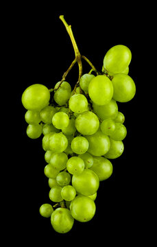 Bunch of green grapes isolated on black background