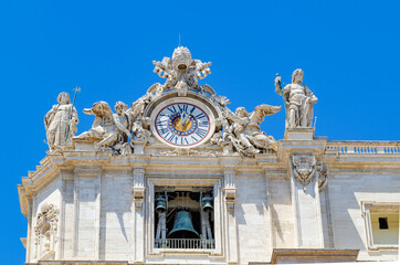Clock detail on the facade of Saint Peter's basilica