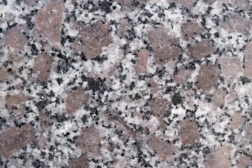 natural granite with gray and beige accents on a black background
