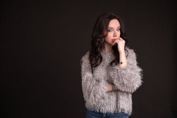 Beautiful girl on a black background. copy space.