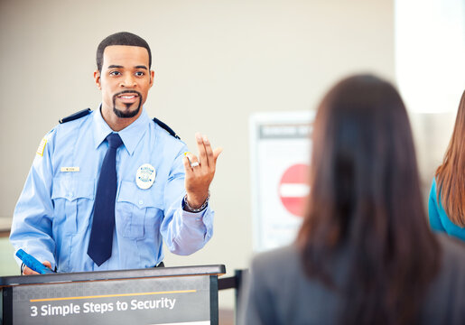 Airport: Security Guard Waves Over Next in Line